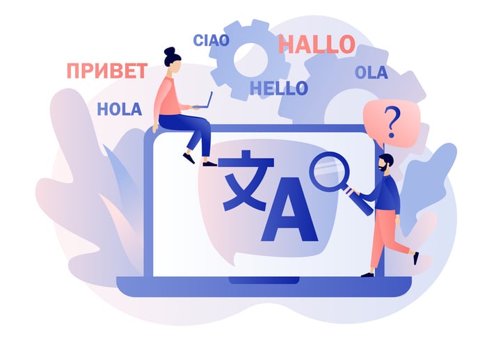 An animated photo of two people on a laptop with "hello" written in different languages.