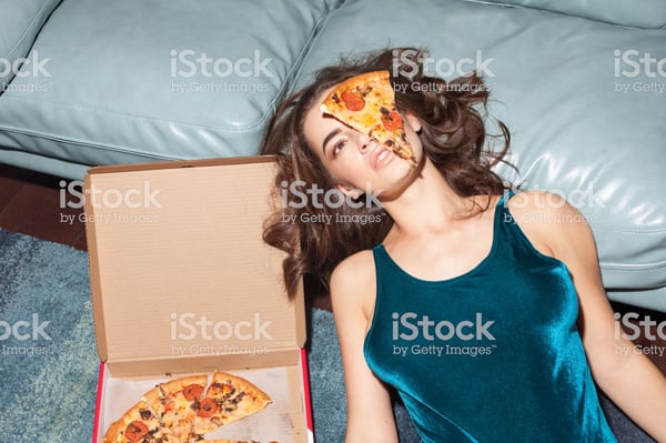 woman with pizza on face